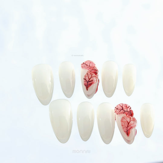 Red Leaves press-on nails set with milky white base and sheer red leaf detailing