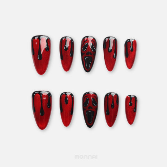 Scarlet Scream press on nails with crimson shimmer, black drips, and horror face design for Halloween