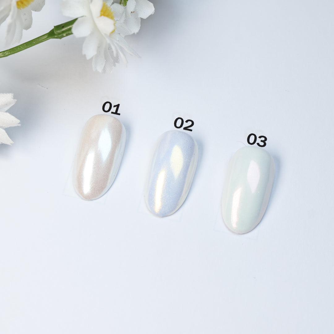 Soft Misty Glow • 9 Colors Available press-on nails laid out in soft shimmer, shown in three pastel shades.