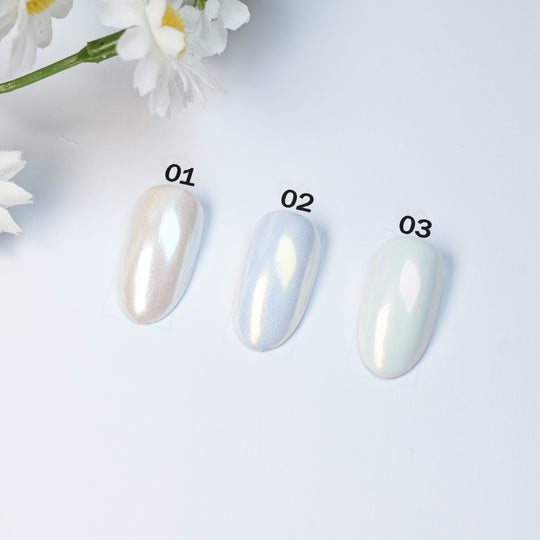 Soft Misty Glow • 9 Colors Available press-on nails laid out in soft shimmer, shown in three pastel shades.