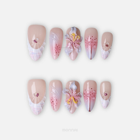 Somewhere in Time press-on nails laid out with 3D orchids, soft purple ombre, shell-textured French tips and jewels
