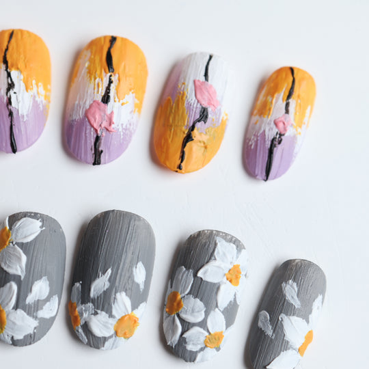 Spring on Canvas press-on nails laid out with gray, ochre, and lilac painterly floral textures and matte canvas-like depth