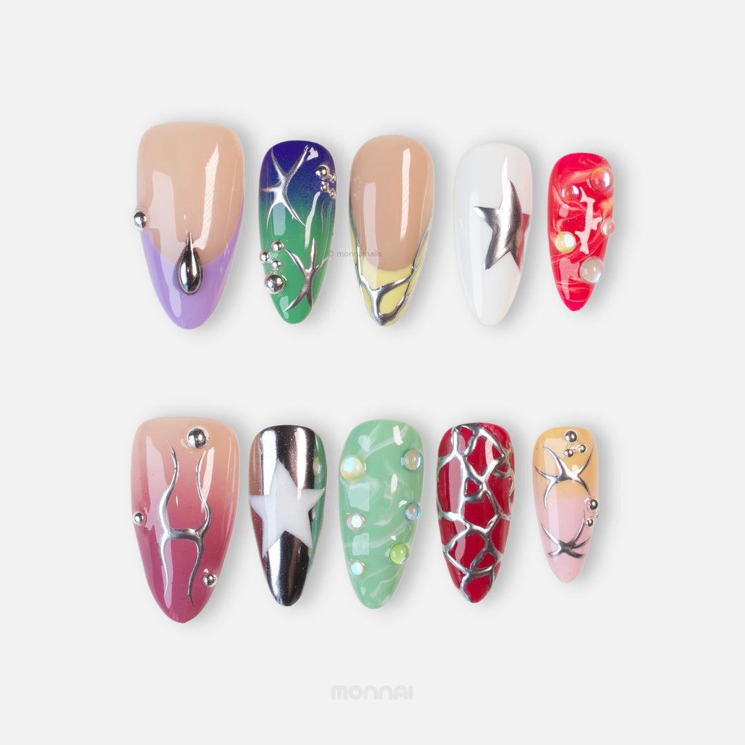 Toxic press-on nails laid out in close-up with chrome stars, liquid metal accents, and Y2K-inspired colors.