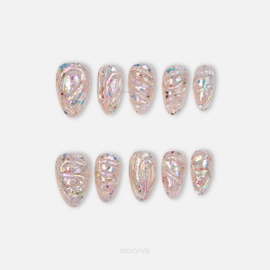 Twinkle press-on nails with sheer nude base, iridescent glitter, and glossy sculpted texture