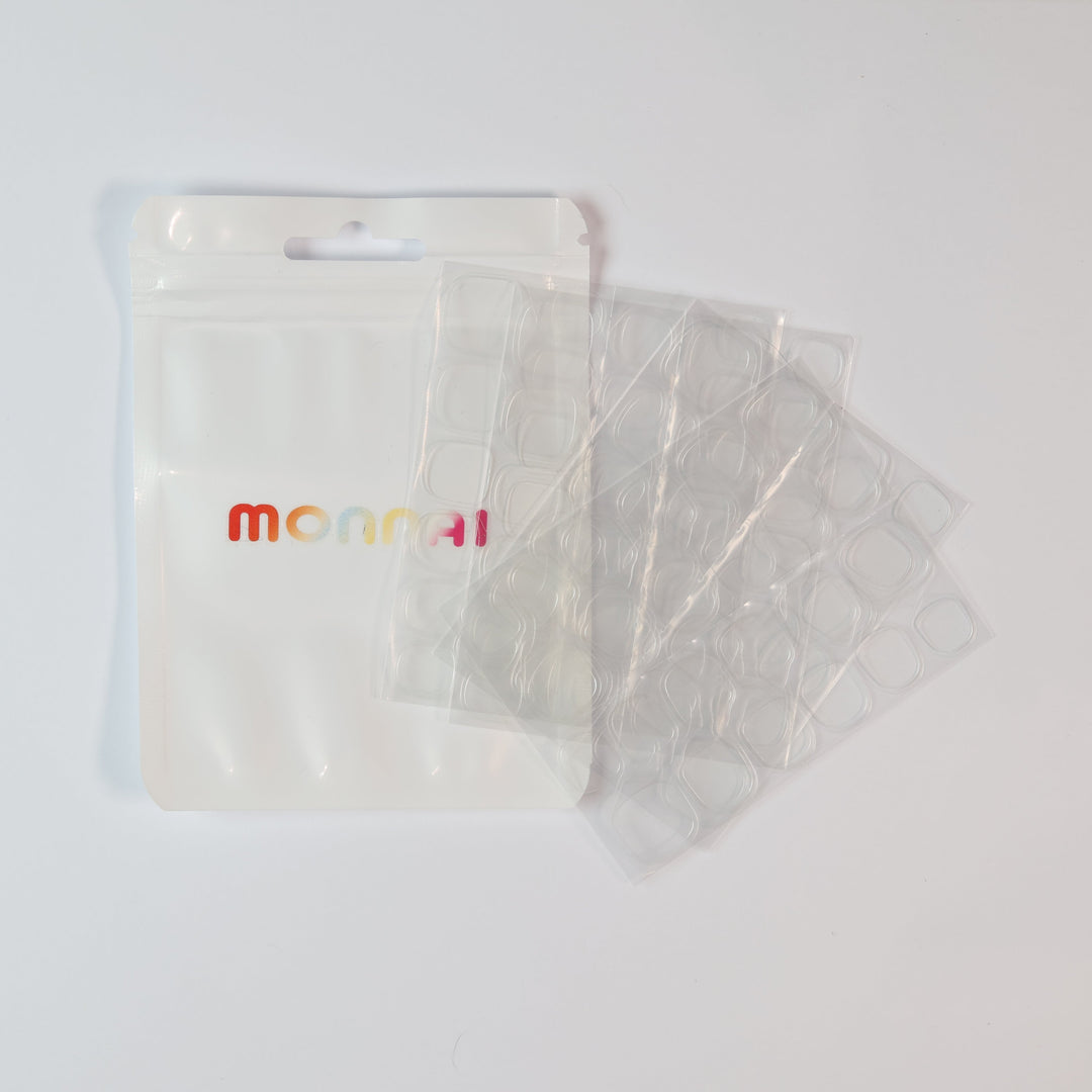 UV Adhesive Tabs(4 Sheets/Box) clear gel tabs for press-on nails in a white pouch