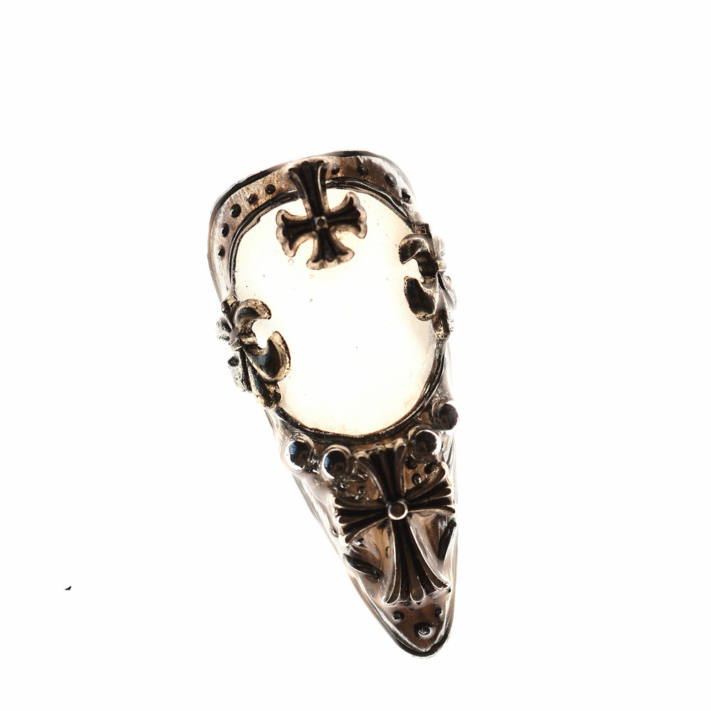 Veil press-on nails with gothic cross emblems and silver metallic frames on a creamy white base