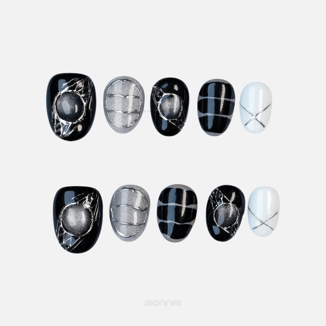 Void Spark press-on nails laid out in black, silver and white with abstract chrome accents and fine linework.