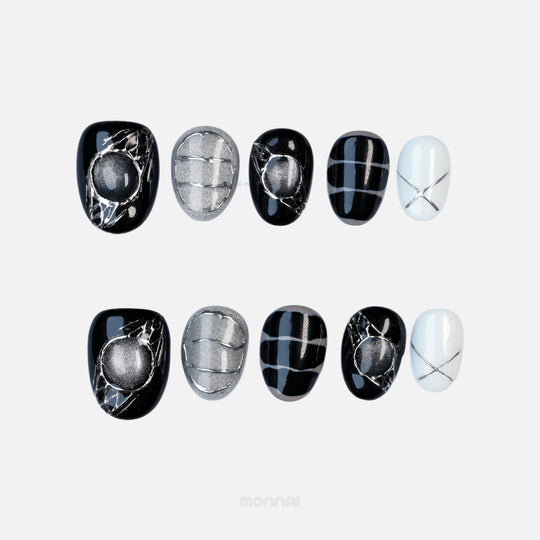 Void Spark press-on nails laid out in black, silver and white with abstract chrome accents and fine linework.