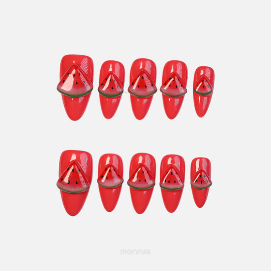 Watermelon Fun press-on nails with glossy red watermelon slice art laid out on a white background