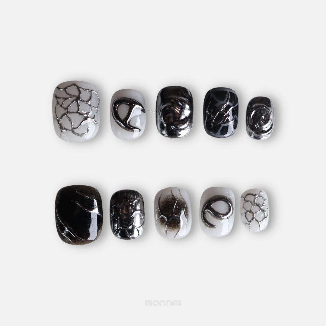 X-Edge press-on nails in monochrome cybercore grunge, laid out with chrome lines and distressed crackle textures.