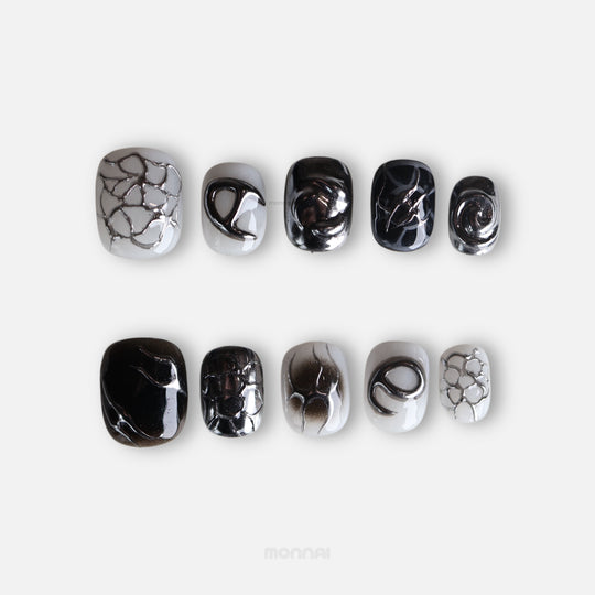 X-Edge press-on nails in monochrome cybercore grunge, laid out with chrome lines and distressed crackle textures.