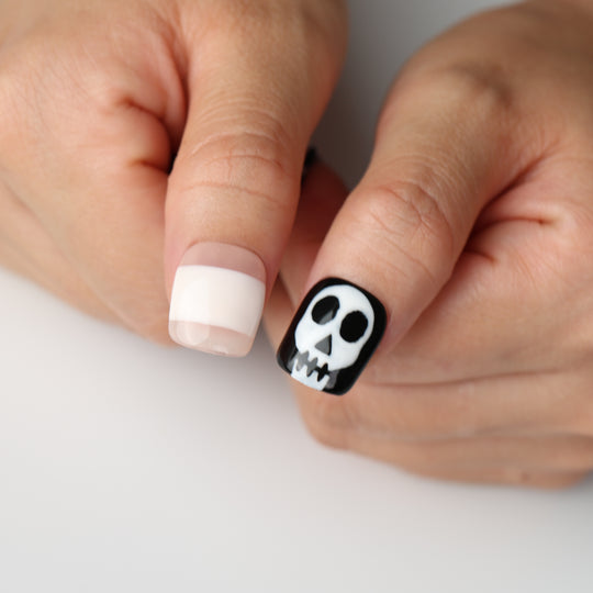 Bone Party press on nails with spooky skull art and black-white Halloween design