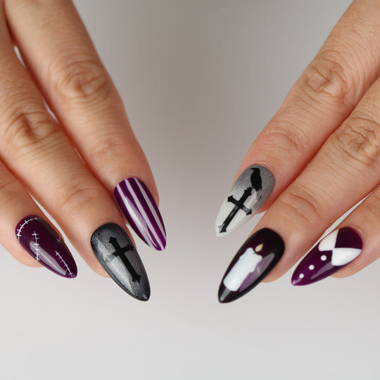 Wednesday press-on nails on hands with purple, black and white gothic designs, crosses, raven and stitched details