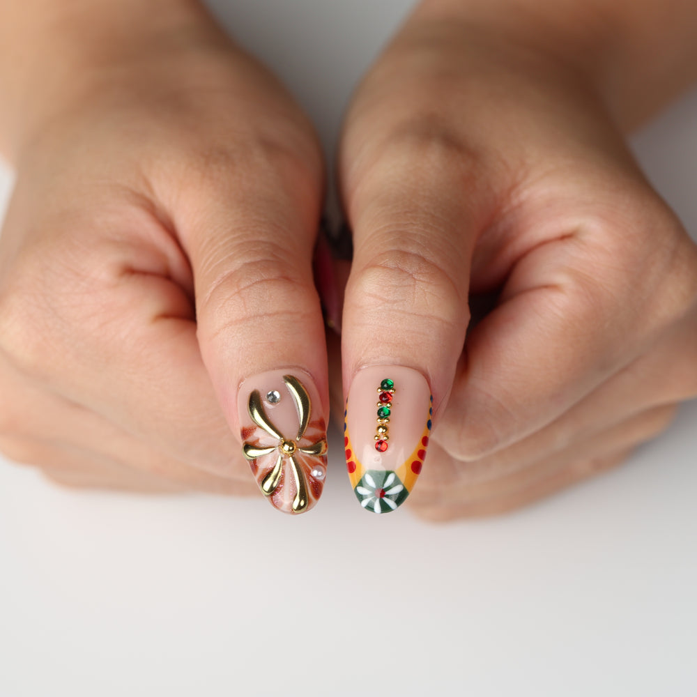 Jewel Carnival boho press on nails with gold floral accents and colorful jewel embellishments
