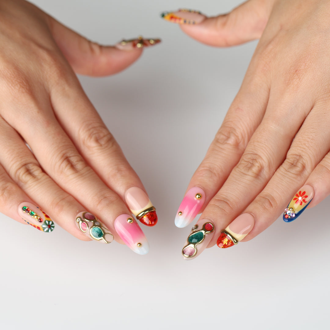 Jewel Carnival boho press on nails with colorful jewels, gold accents, floral motifs and pink nude gradients