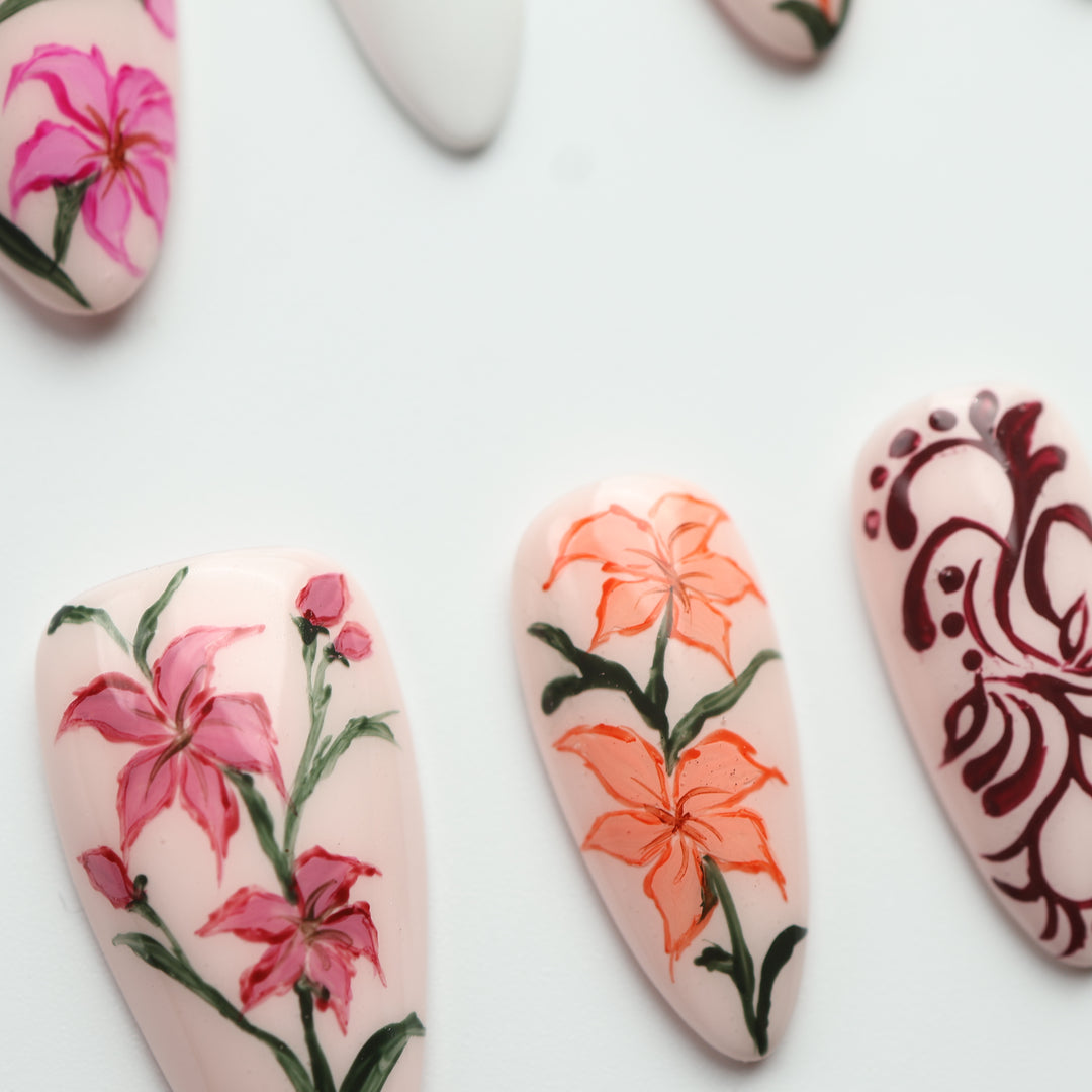 Porcelain Garden press on nails with delicate pink, orange and burgundy floral designs
