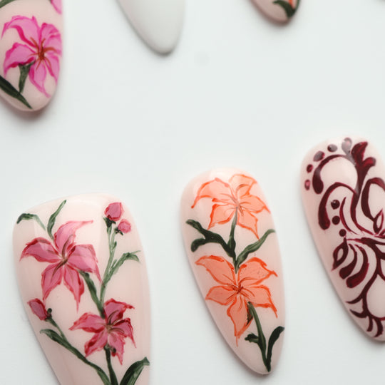 Porcelain Garden press on nails with delicate pink, orange and burgundy floral designs